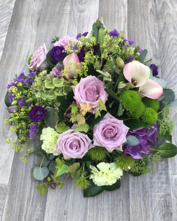 lilac and purple posy display - funeral tribute design - lilac rose - purple lisianthus - calla lily 