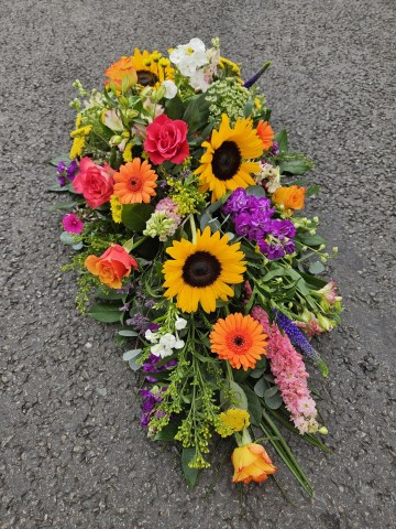 vibrant single ended spray - sunflowers - germini - larkspur - summer mix funeral tribute 