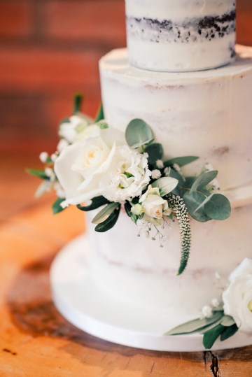 ivory and white flowers for wedding cake  - avalanche rose - lisianthus - hydrangea - wedding at wooten park wedding venue 