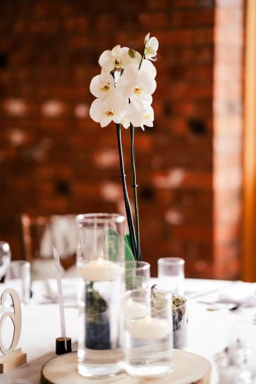 ivory and white wedding flowers - ivory avalanche roses - lisianthus - hydrangea - bridal bouquet - wedding at Wooten Park Wedding Venue - phalaenopsis orchid table displays 