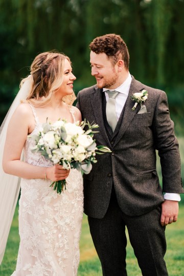 ivory and white wedding flowers - ivory avalanche roses - lisianthus - hydrangea - bridal bouquet - wedding at Wooten Park Wedding Venue - bride and groom flowers