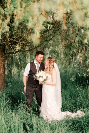 ivory and white wedding flowers - ivory avalanche roses - lisianthus - hydrangea - bridal bouquet - wedding at Wooten Park Wedding Venue - bride and groom flowers