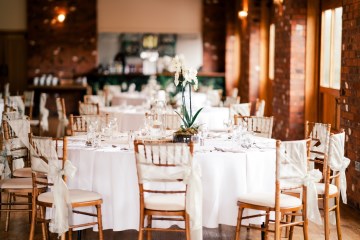 ivory and white wedding flowers - ivory avalanche roses - lisianthus - hydrangea - bridal bouquet - wedding at Wooten Park Wedding Venue - phalaenopsis orchid table display 