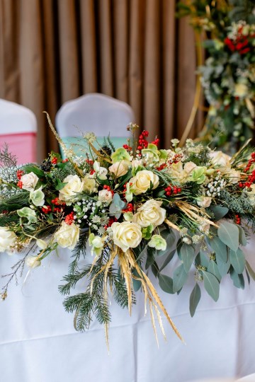 christmas wedding in solihull - festive wedding flowers - ivory and ruby wedding flowers - moongate flowers - ceremony flowers 