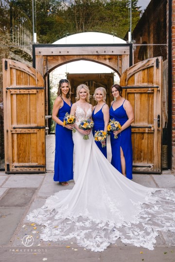 yellow and blue theme wedding at shustoke farm barns - yellow and blue flowers - yellow roses - blue delphiniums - sunflowers - blue thistle - buttonholes - bridesmaids bouquets