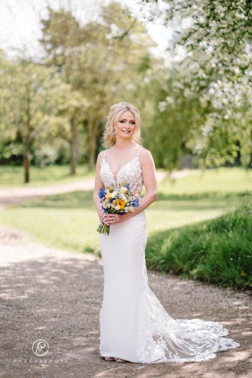 yellow and blue theme wedding at shustoke farm barns - yellow and blue flowers - yellow roses - blue delphiniums - sunflowers - blue thistle - buttonholes - bridesmaids bouquets