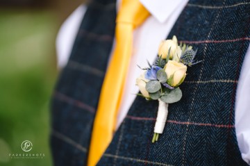 yellow and blue theme wedding at shustoke farm barns - yellow and blue flowers - yellow roses - blue delphiniums - sunflowers - blue thistle - buttonholes - bridesmaids bouquets