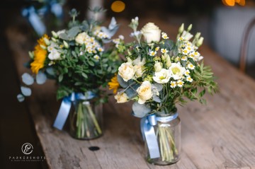 yellow and blue theme wedding at shustoke farm barns - yellow and blue flowers - yellow roses - blue delphiniums - sunflowers - blue thistle - buttonholes - bridesmaids bouquets