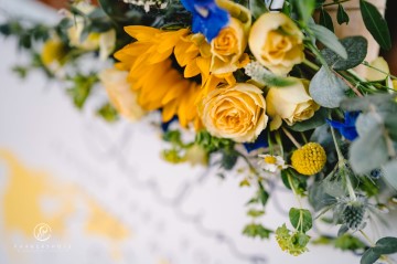 yellow and blue theme wedding at shustoke farm barns - yellow and blue flowers - yellow roses - blue delphiniums - sunflowers - blue thistle - buttonholes - bridesmaids bouquets