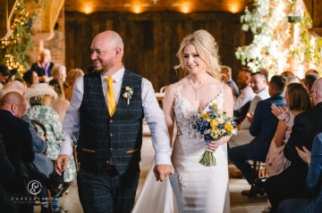 yellow and blue theme wedding at shustoke farm barns - yellow and blue flowers - yellow roses - blue delphiniums - sunflowers - blue thistle - buttonholes - bridesmaids bouquets