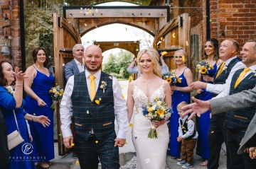 yellow and blue theme wedding at shustoke farm barns - yellow and blue flowers - yellow roses - blue delphiniums - sunflowers - blue thistle - buttonholes - bridesmaids bouquets