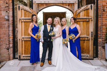 yellow and blue theme wedding at shustoke farm barns - yellow and blue flowers - yellow roses - blue delphiniums - sunflowers - blue thistle - buttonholes - bridesmaids bouquets