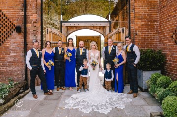 yellow and blue theme wedding at shustoke farm barns - yellow and blue flowers - yellow roses - blue delphiniums - sunflowers - blue thistle - buttonholes - bridesmaids bouquets