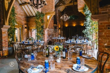 yellow and blue theme wedding at shustoke farm barns - yellow and blue flowers - yellow roses - blue delphiniums - sunflowers - blue thistle - buttonholes - bridesmaids bouquets