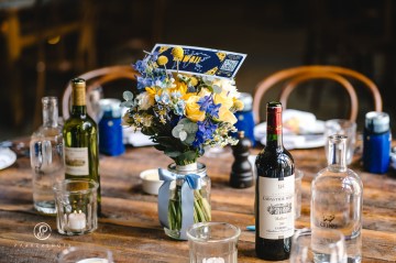 yellow and blue theme wedding at shustoke farm barns - yellow and blue flowers - yellow roses - blue delphiniums - sunflowers - blue thistle - buttonholes - bridesmaids bouquets