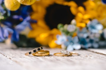 yellow and blue theme wedding at shustoke farm barns - yellow and blue flowers - yellow roses - blue delphiniums - sunflowers - blue thistle - buttonholes - bridesmaids bouquets