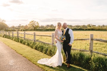 yellow and blue theme wedding at shustoke farm barns - yellow and blue flowers - yellow roses - blue delphiniums - sunflowers - blue thistle - buttonholes - bridesmaids bouquets