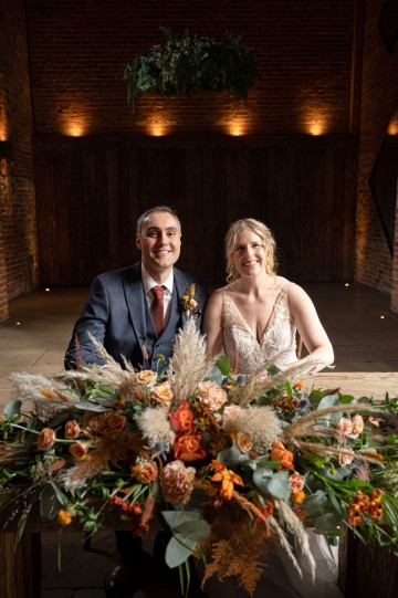 registrar table flowers  - autumnal wedding flowers - shustoke farm barns wedding coleshill