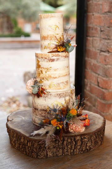 wedding cake flowers - autumnal wedding flowers - shustoke farm barns wedding coleshill