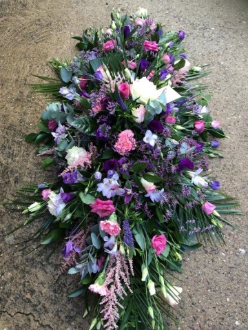 purple lilac and pink country garden casket spray 