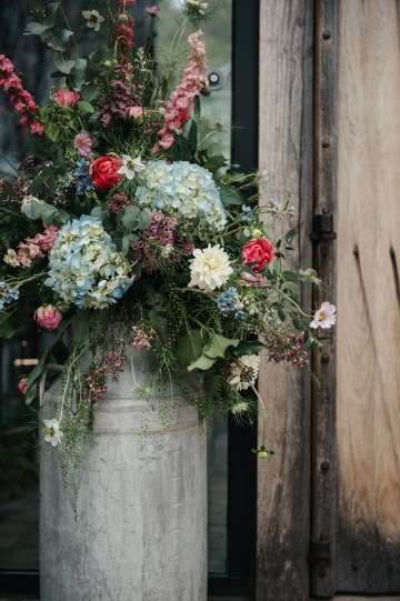 Milk churn floral display - wild flowers - hydrangea - cerise rose - summer flowers - shustoke farm barns 