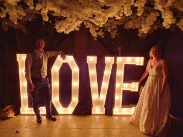 Light up LOVE letters - marquee lights - bride and groom at shustoke farm barns 