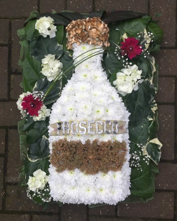 Bottle of Prosecco funeral tribute spray - funeral flowers 
