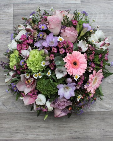 pink and lilac posy display - funeral tribute posy design - lilac rose pink germini green carnation -mixed pink lilac and green flowers 