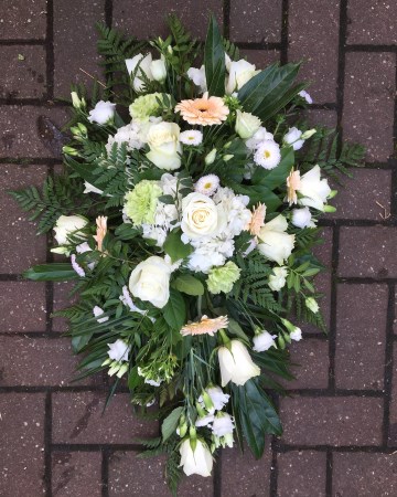 ivory and peach single ended spray funeral tribute - peach germini - ivory roses - lisianthus- hydrangea - spray cars - green carnation 