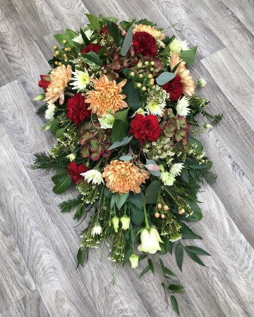autumnal mix single ended spray - funeral tribute design - deep red - peach -ivory - carnation  xanth bloom - hypericum - hydrangea - roses - lisianthus 