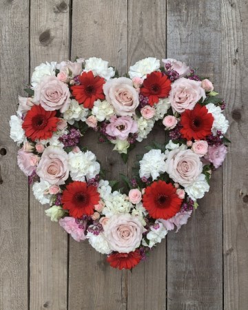 blush ivory and red open heart design featuring nude roses and red germini 