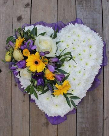 based heart with yellow and purple spray funeral tribute 