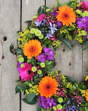 mixed wreath design of vibrant flowers 