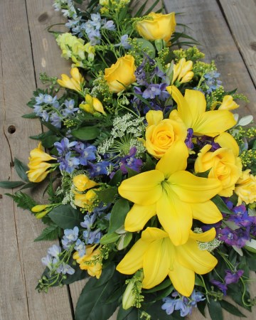 lemon and blue single ended spray - yellow lily rose and blue delphinium 