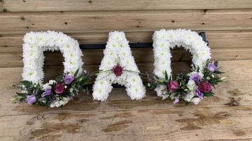 DAD funeral tribut- based in white chrysanth- with lilac and purple sprays 