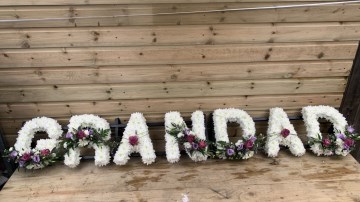 Grandad funeral tribute - based in white chrysanth with lilac and purple sprays 