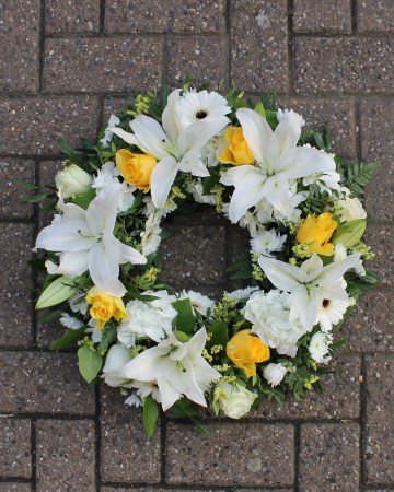 white lily and yellow rose wreath